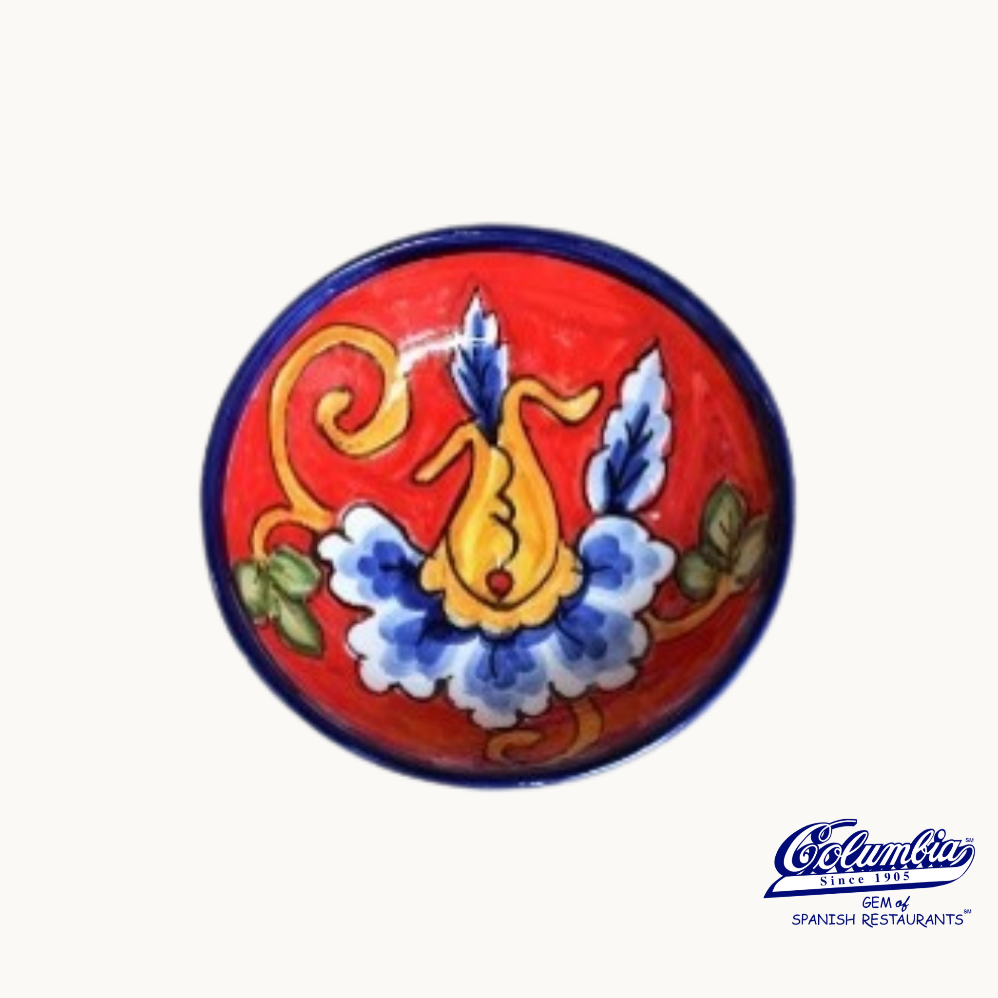 Colorful ceramic plate with intricate designs on a white background