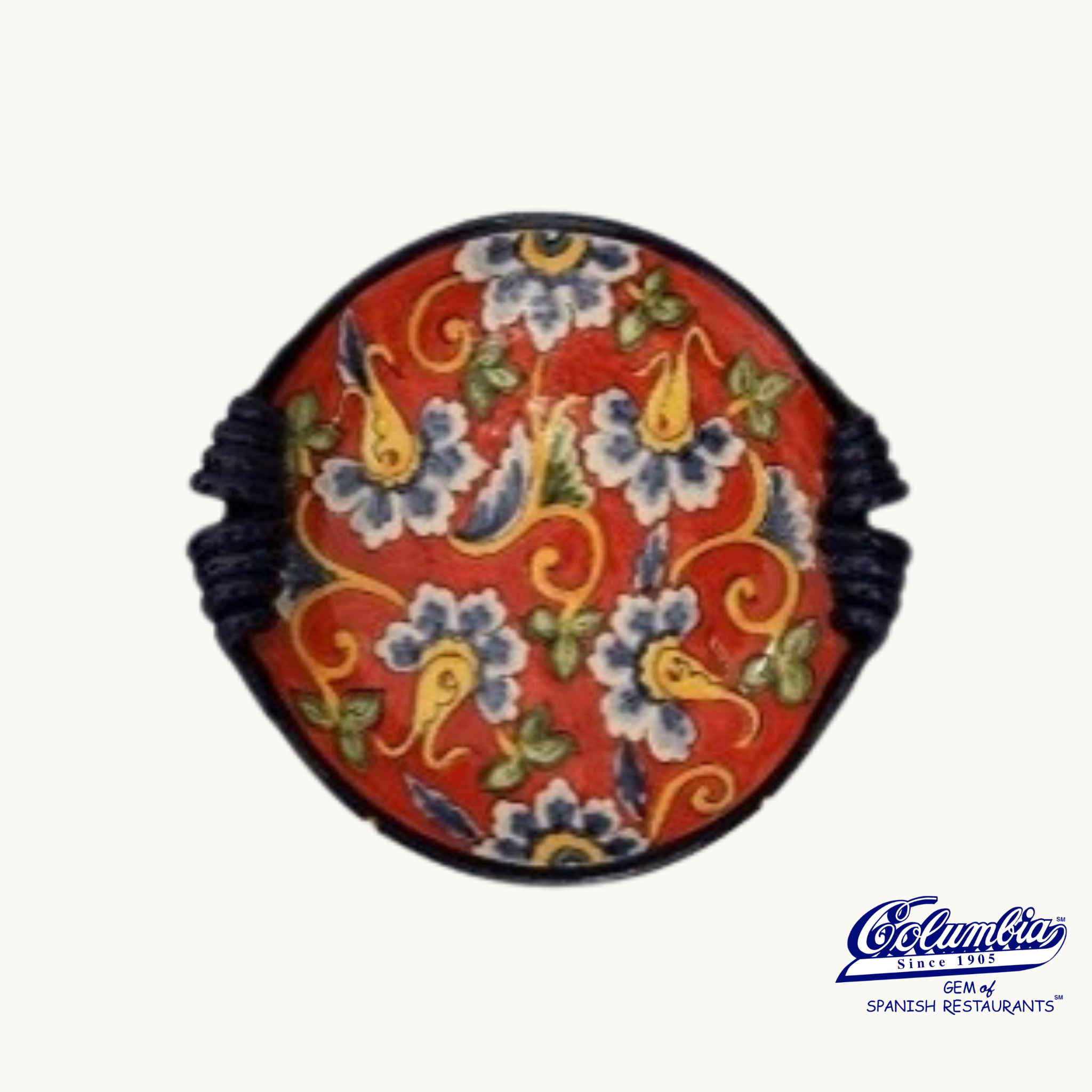 Decorative bowl with floral patterns on a red background.