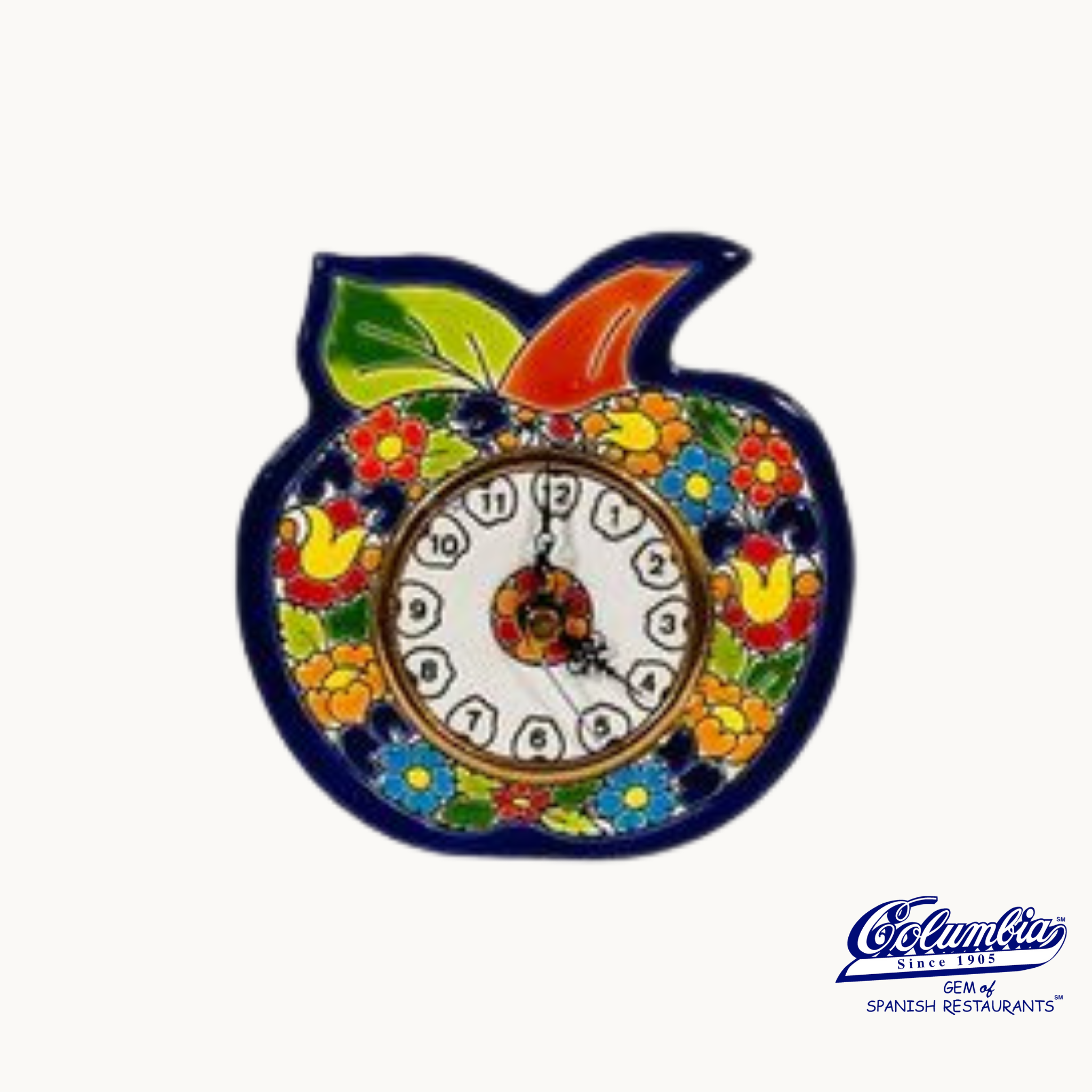 A colorful ceramic apple-shaped clock with a floral pattern and a face visible in the center.
