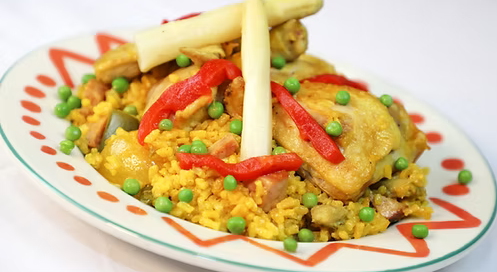 Rice and Chicken on a white and red plate n a white background