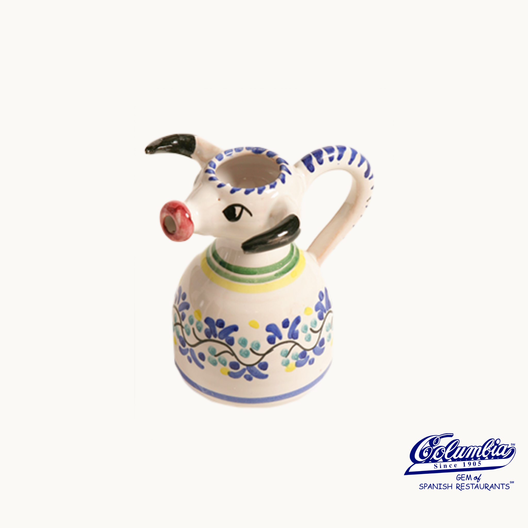 Decorative ceramic pitcher with floral patterns on a white background