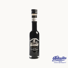 A bottle of Columbia 10-year-old Balsamic Vinegar from Rioja, Spain, with a black label and a decorative logo in white.