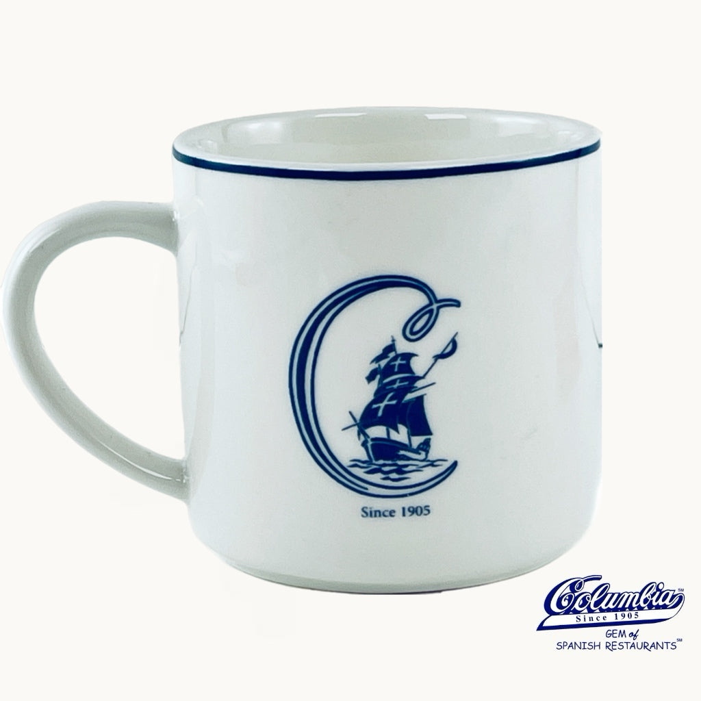 White Coffee Mug with C and a ship in it. on white background