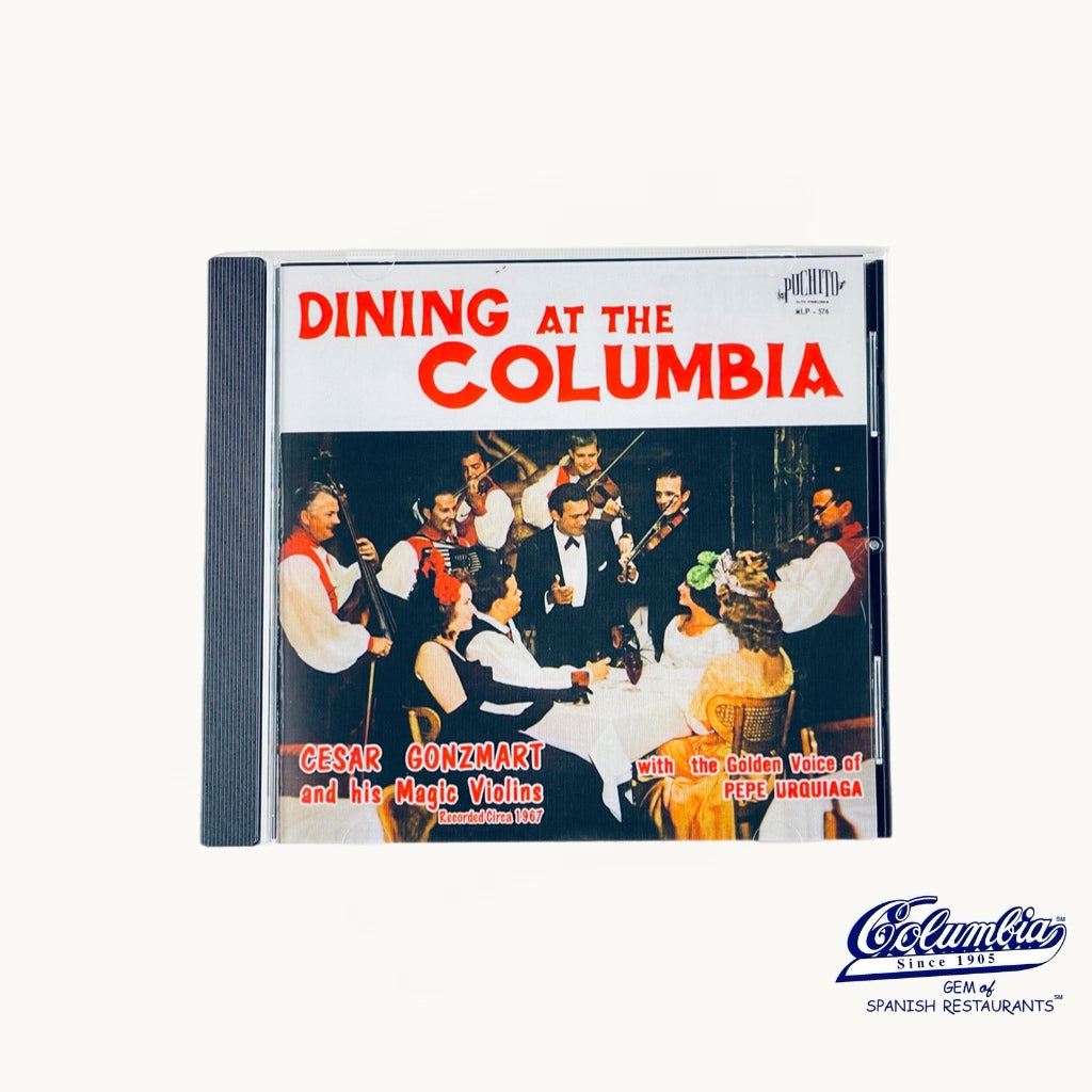 CD cover for 'Dining at the Columbia' featuring a vintage restaurant scene with people and musicians.