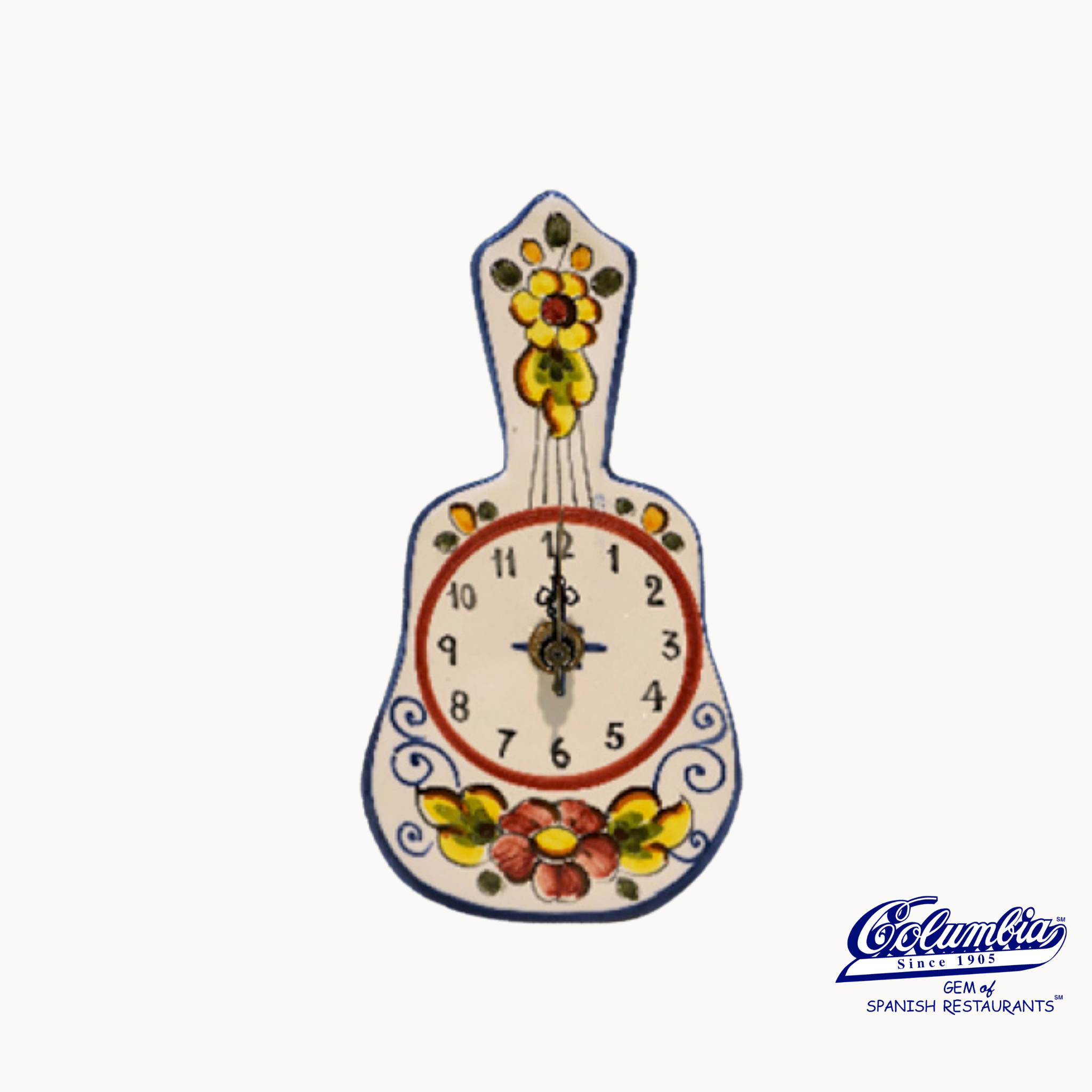 Decorative wall clock with floral designs on a white background