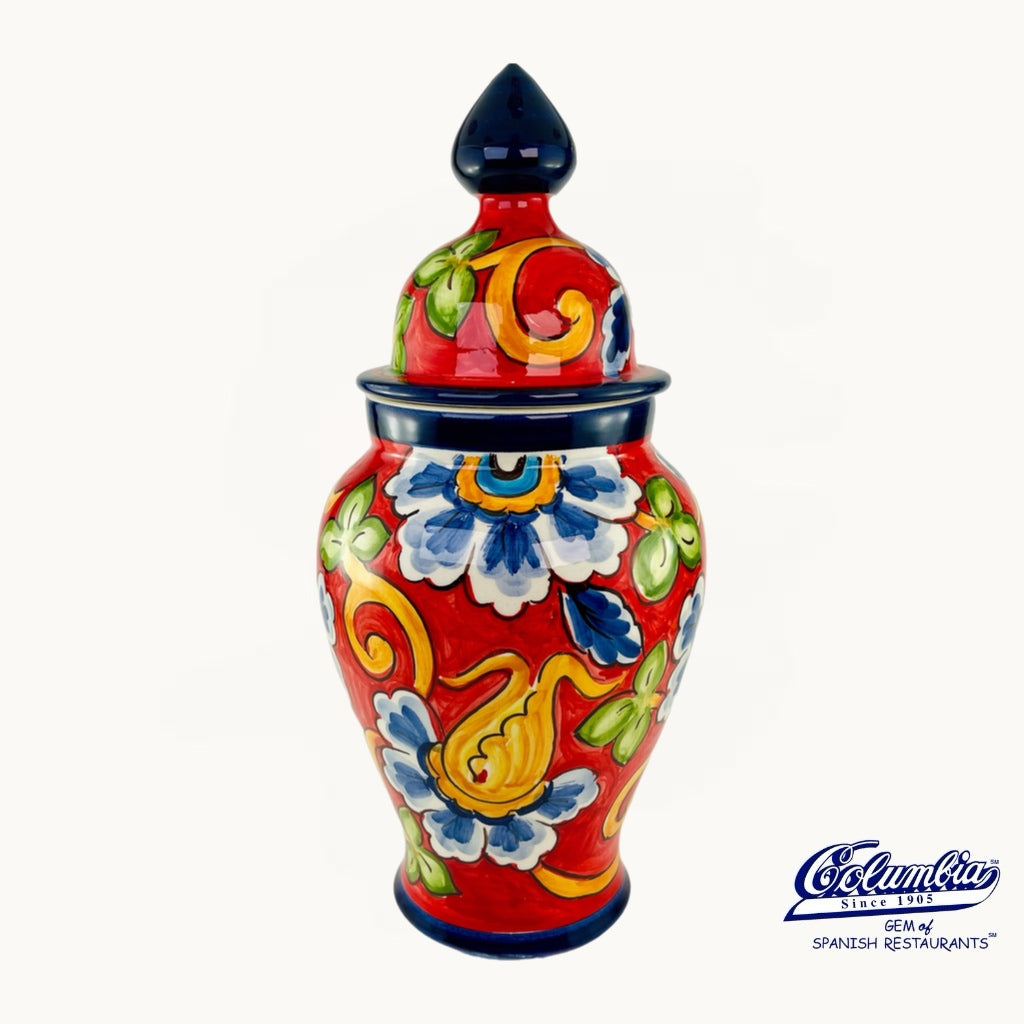 Colorful ceramic jar with floral designs on a white background, featuring the Cocolina logo.