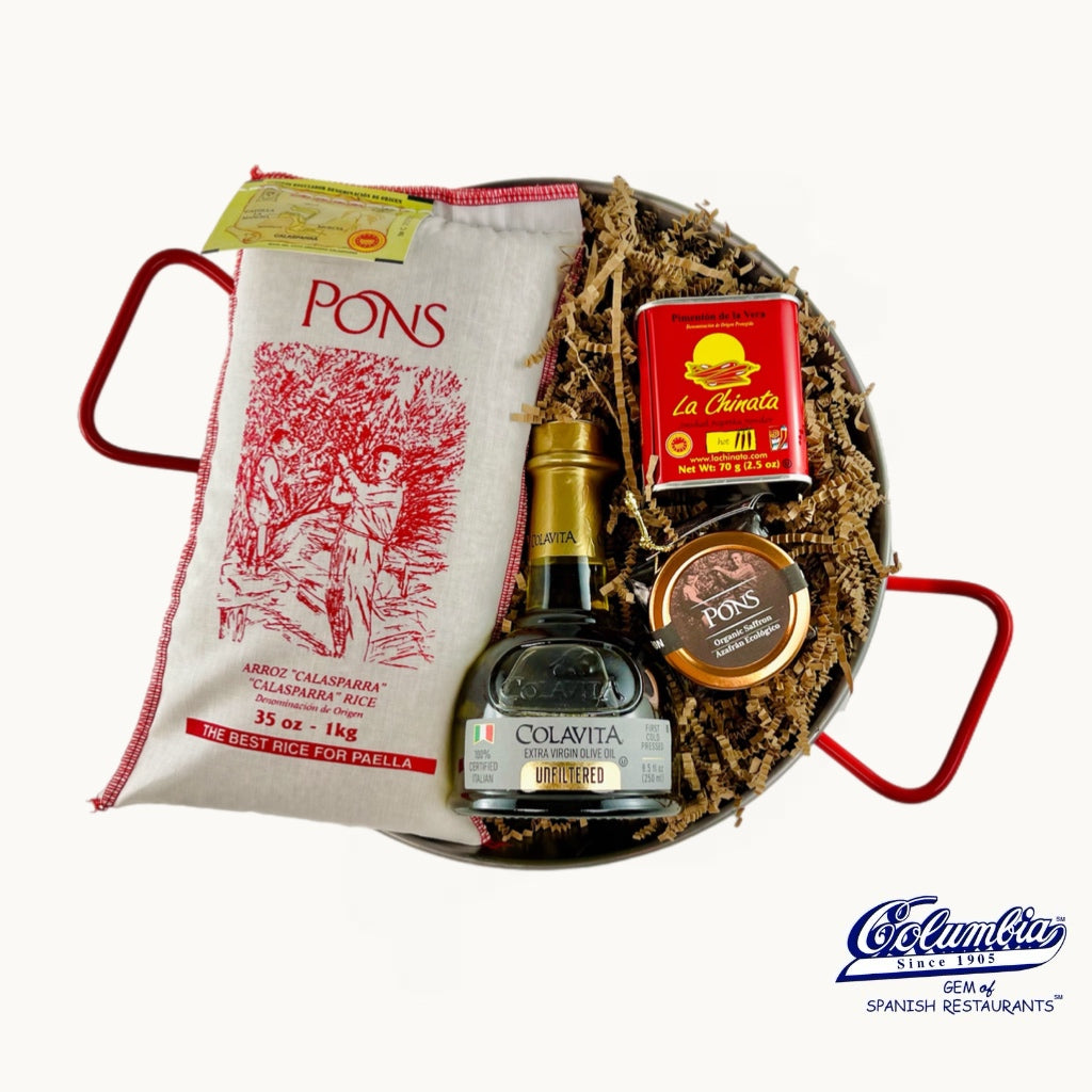 Gift set with Colavita bottle, Pons rice bag, and La Chinita packaging on a white background.