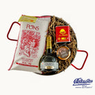 Gift set with Colavita bottle, Pons rice bag, and La Chinita packaging on a white background.