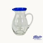 Clear glass pitcher with blue rim on white background