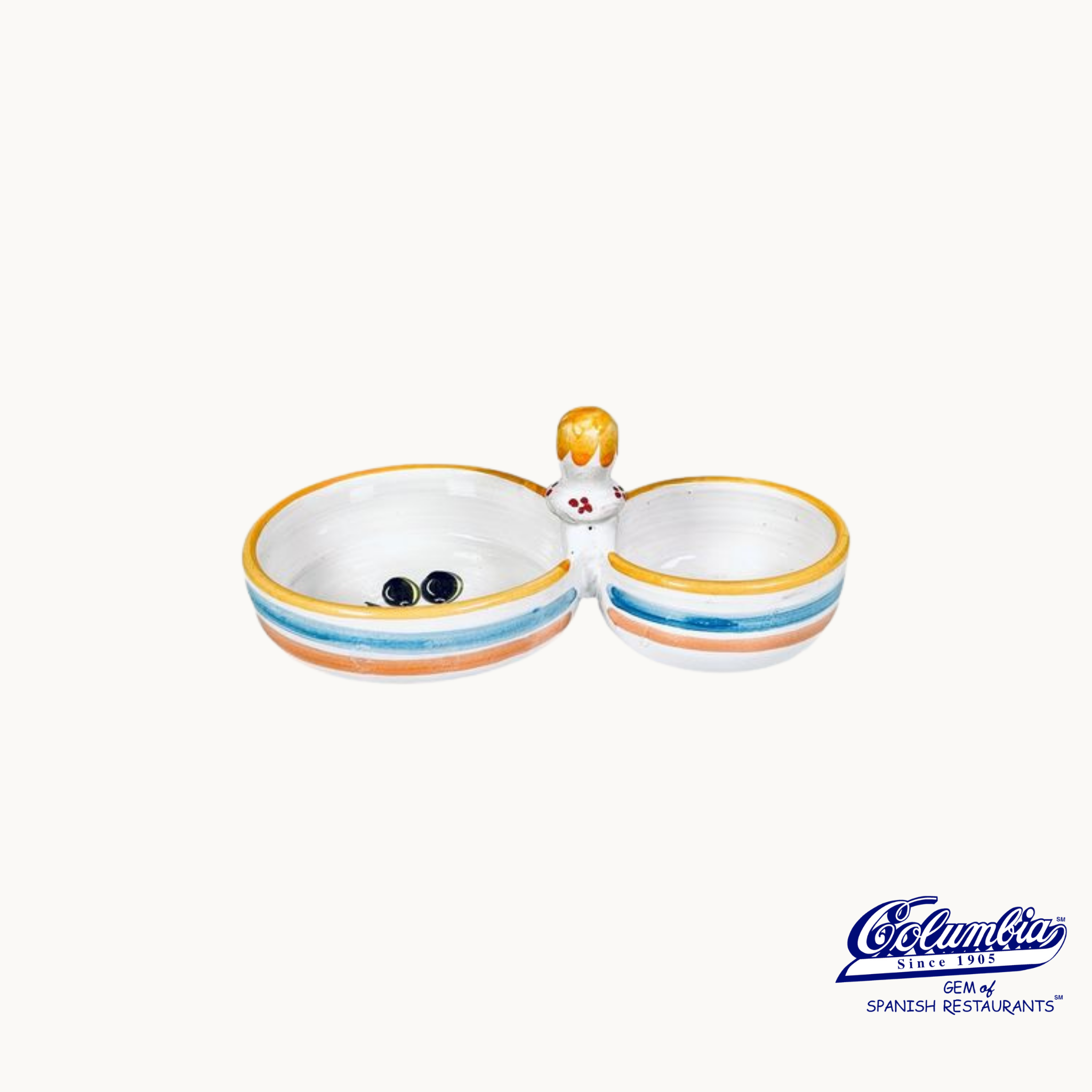 Ceramic dish with a handle resembling a character on a white background