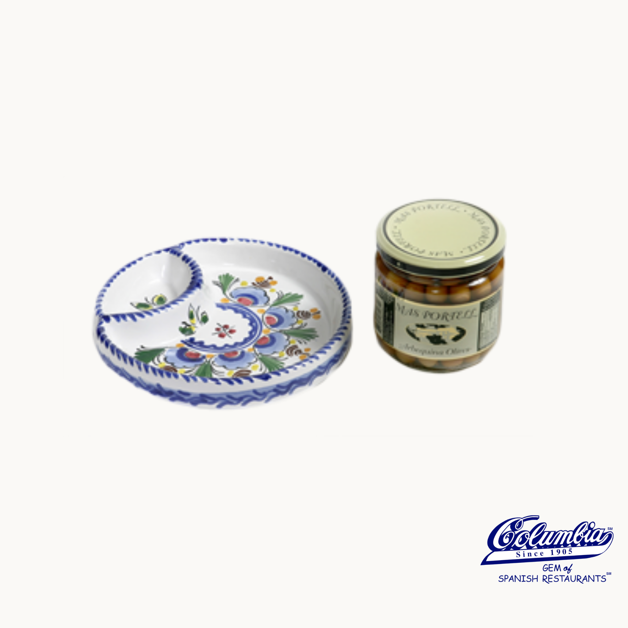 Decorative ceramic plate and jar of olives on a white background