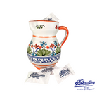 Decorative ceramic pitcher with colorful patterns and Columbia Spanish Restaurants packaging on a white background