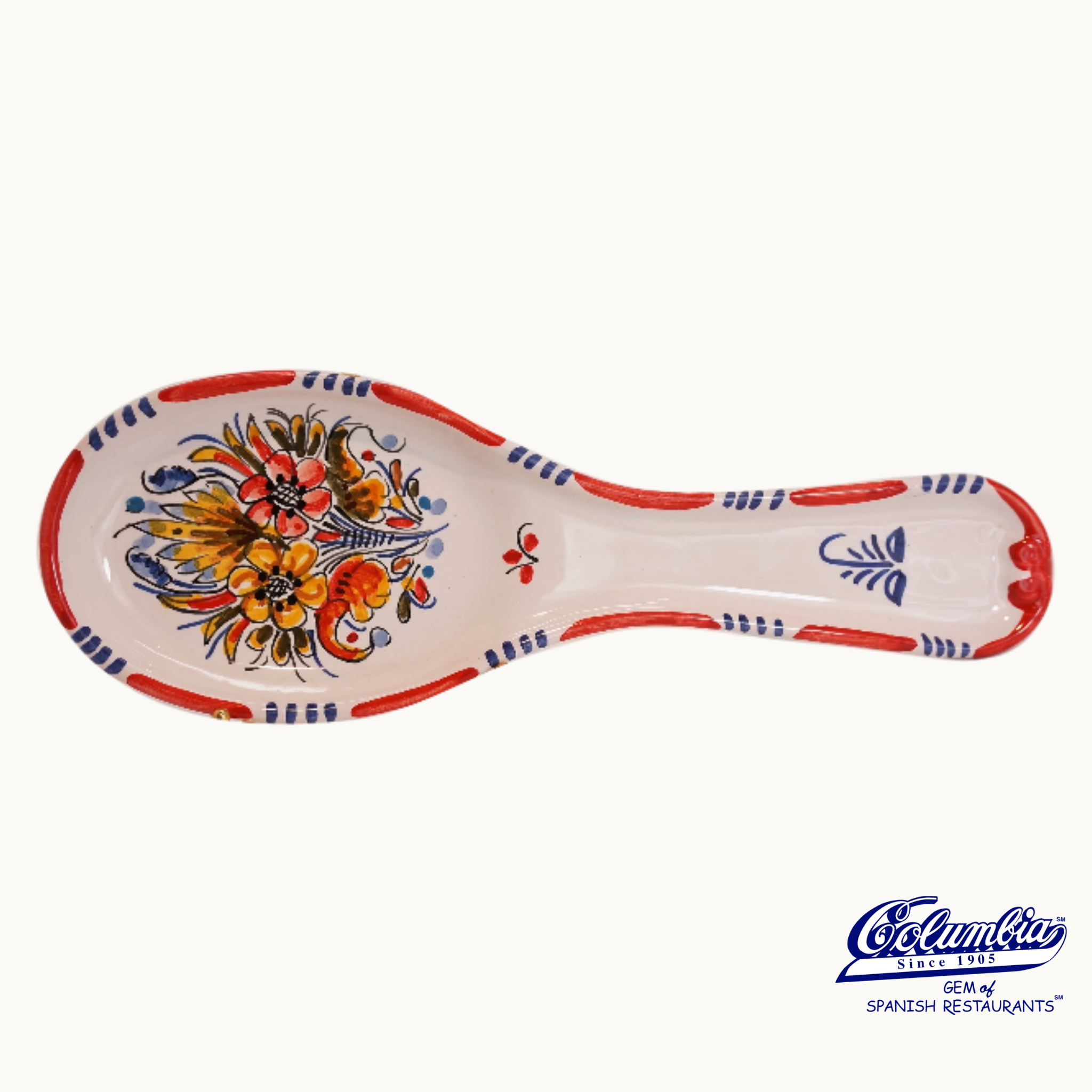 Ceramic spoon rest with colorful floral patterns on a white background