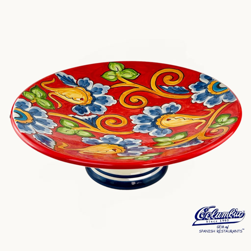 Decorative ceramic plate with colorful floral design on a white background