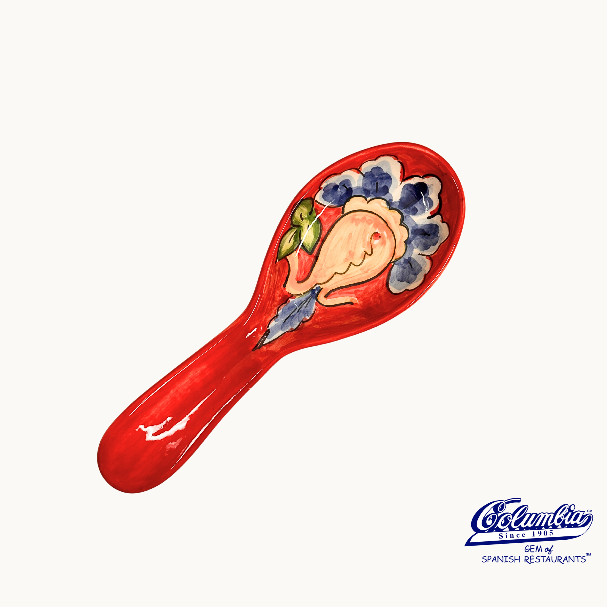 Decorative ceramic spoon rest with floral design on a white background, featuring the El Flamenco logo.