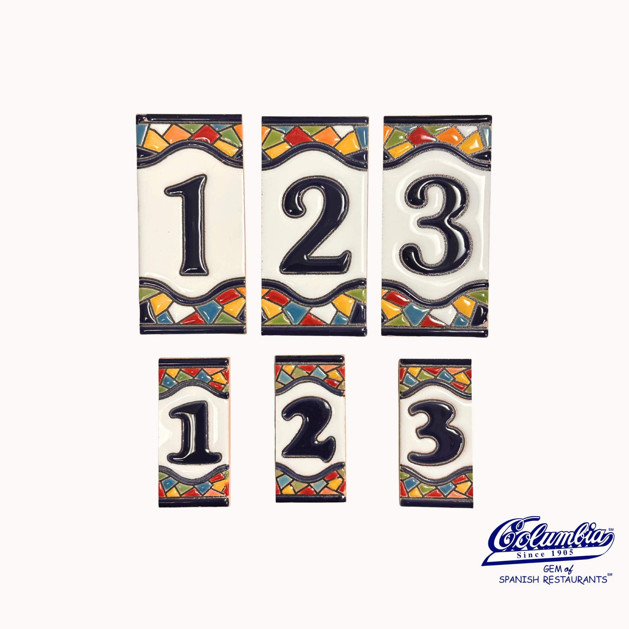 Set of ceramic house numbers '123' with colorful borders on a white background.