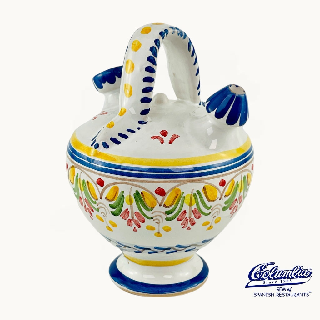 Decorative ceramic jar with colorful patterns on a white background, featuring the Columba brand.