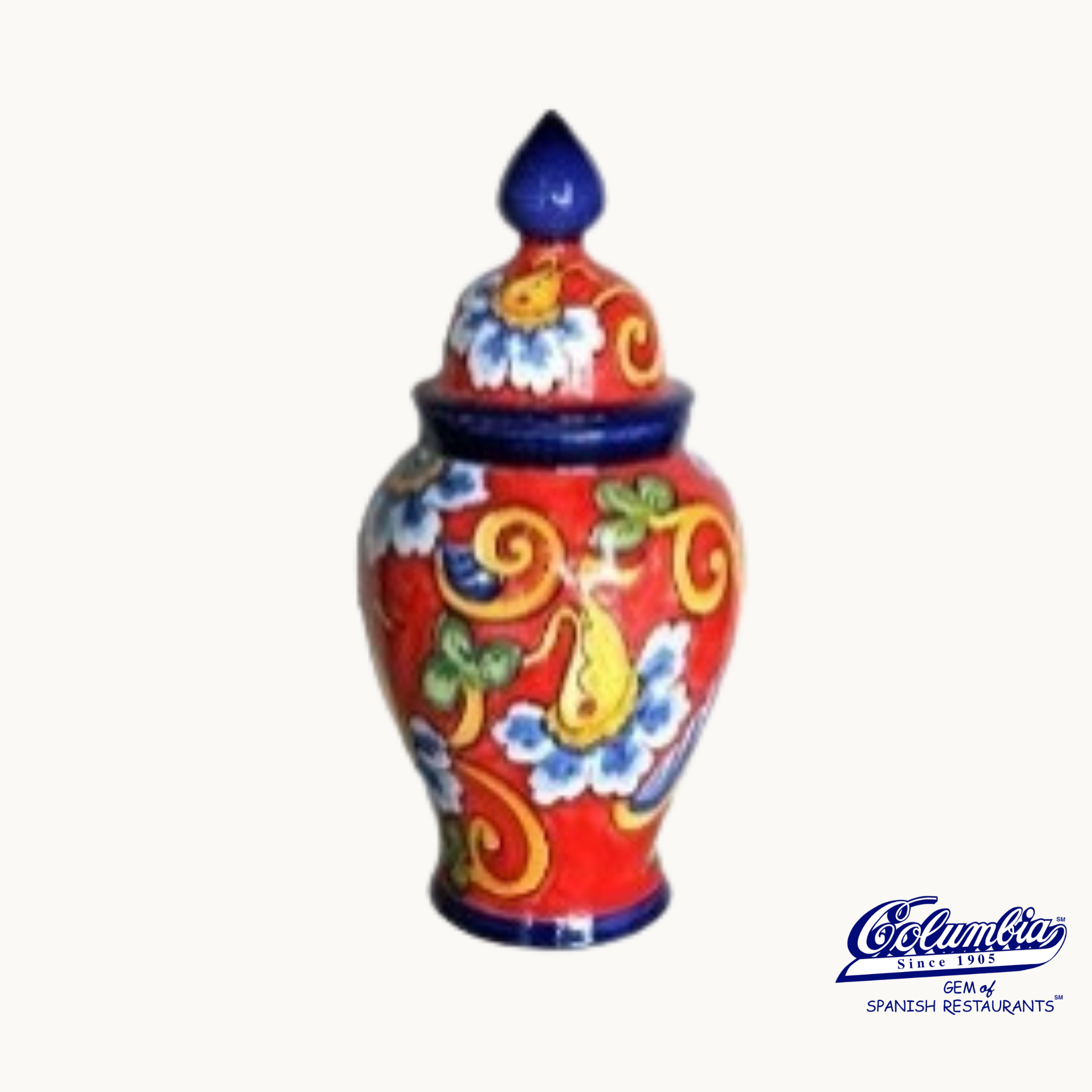 Colorful ceramic jar with intricate patterns on a white background