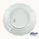 Back of ceramic plate with a logo on it.