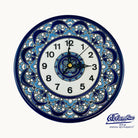 Decorative wall clock with blue floral patterns on a white background