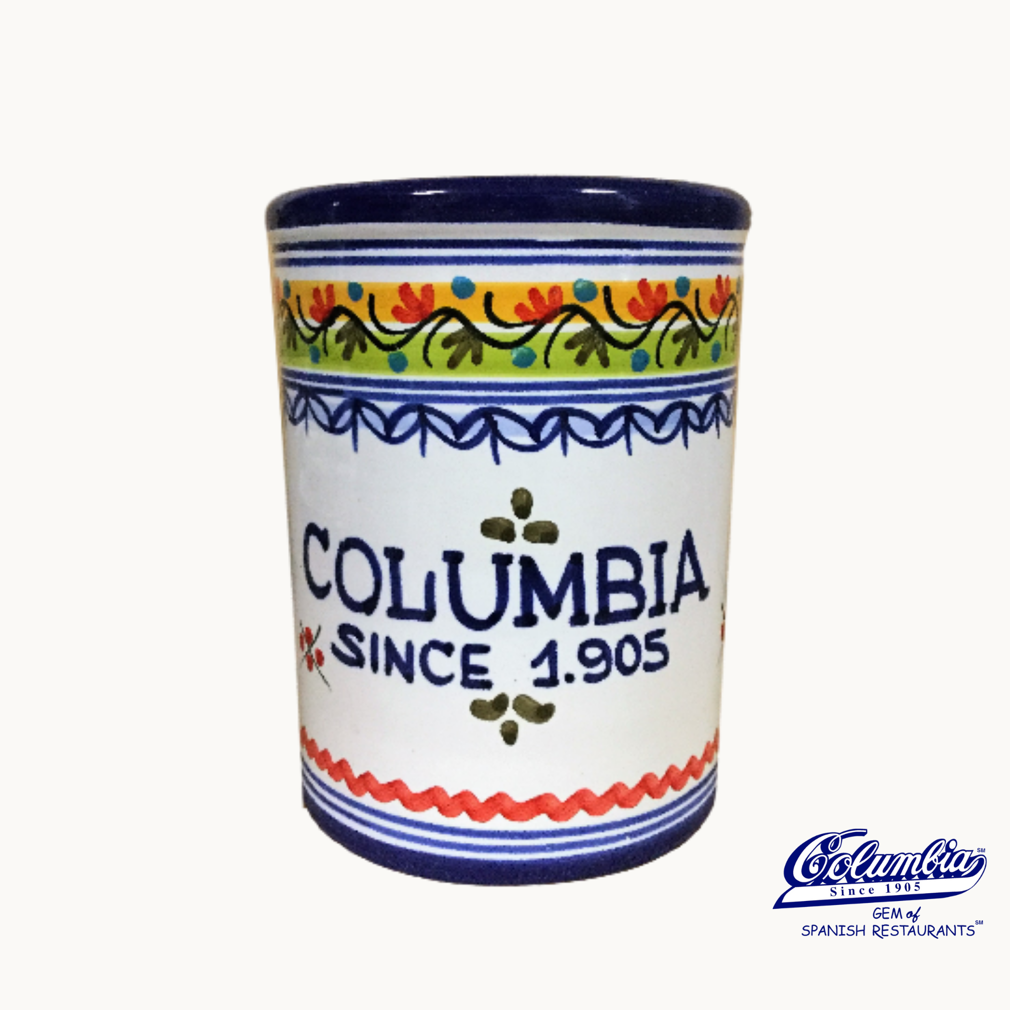 A hand painted ceramic wine cooler with multicolor floral patterns and 'COLUMBIA SINCE 1905' printed on the side.