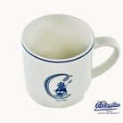Top view of a white mug with a columbia logo on it with a white background