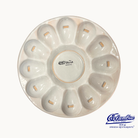 Ceramic oyster plate with 'España' branding on a white background