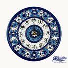 Decorative wall clock with blue and white floral patterns on a white background
