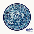 Decorative plate with blue and white intricate design, featuring a scene of people on horseback.