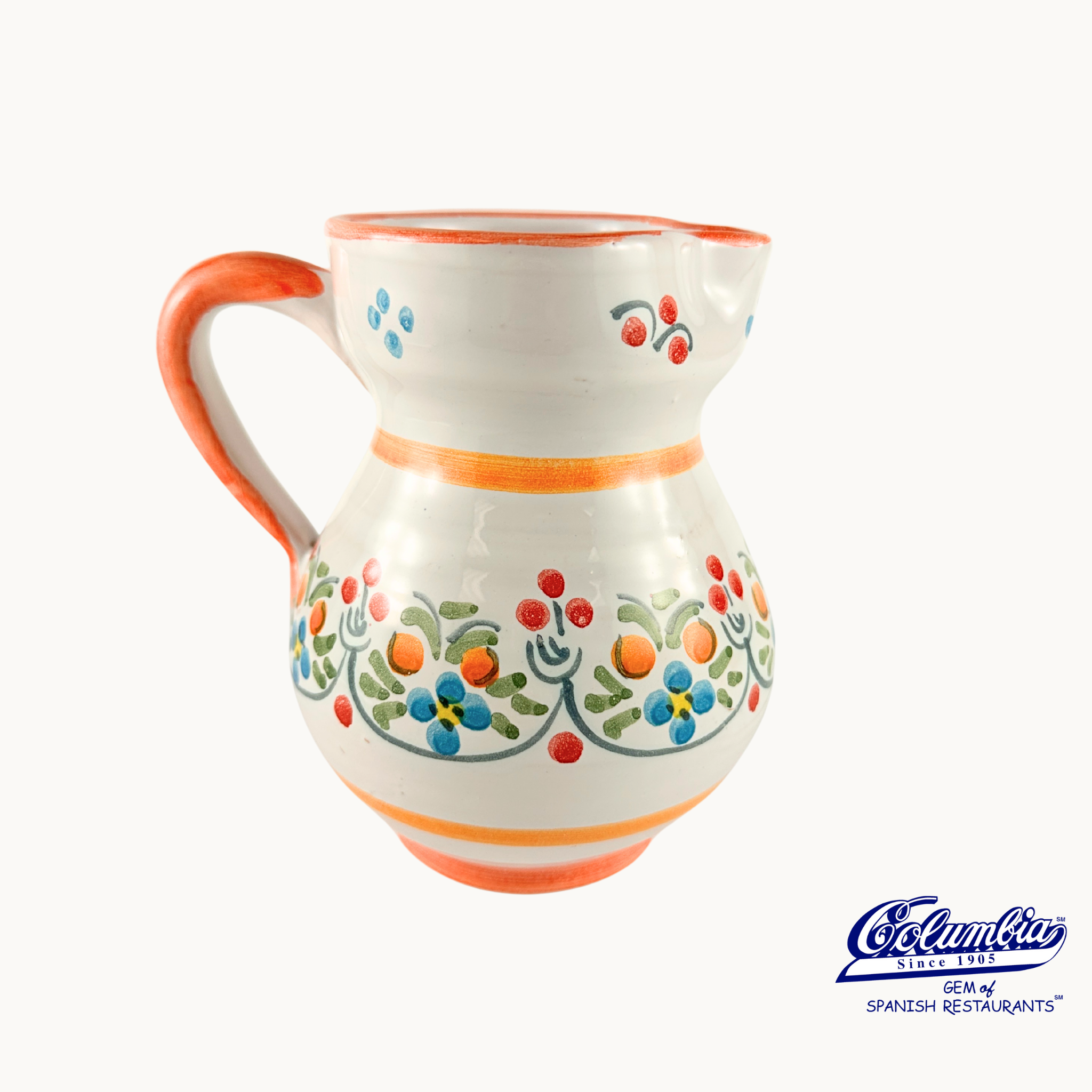 Ceramic pitcher with colorful floral patterns on a white background, featuring the columbia logo.