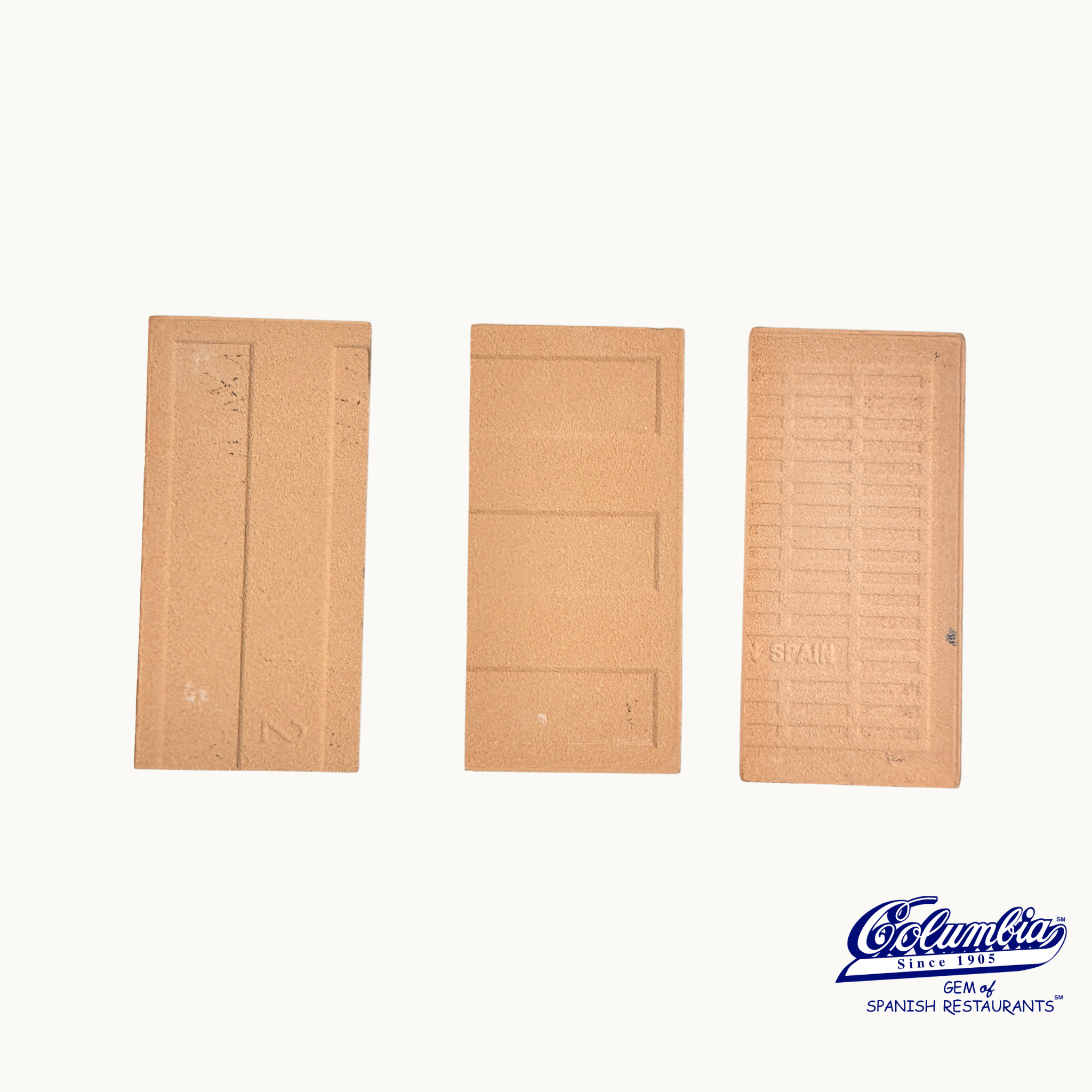 Three wooden doors with different designs on a white background, featuring the Colomina logo.
