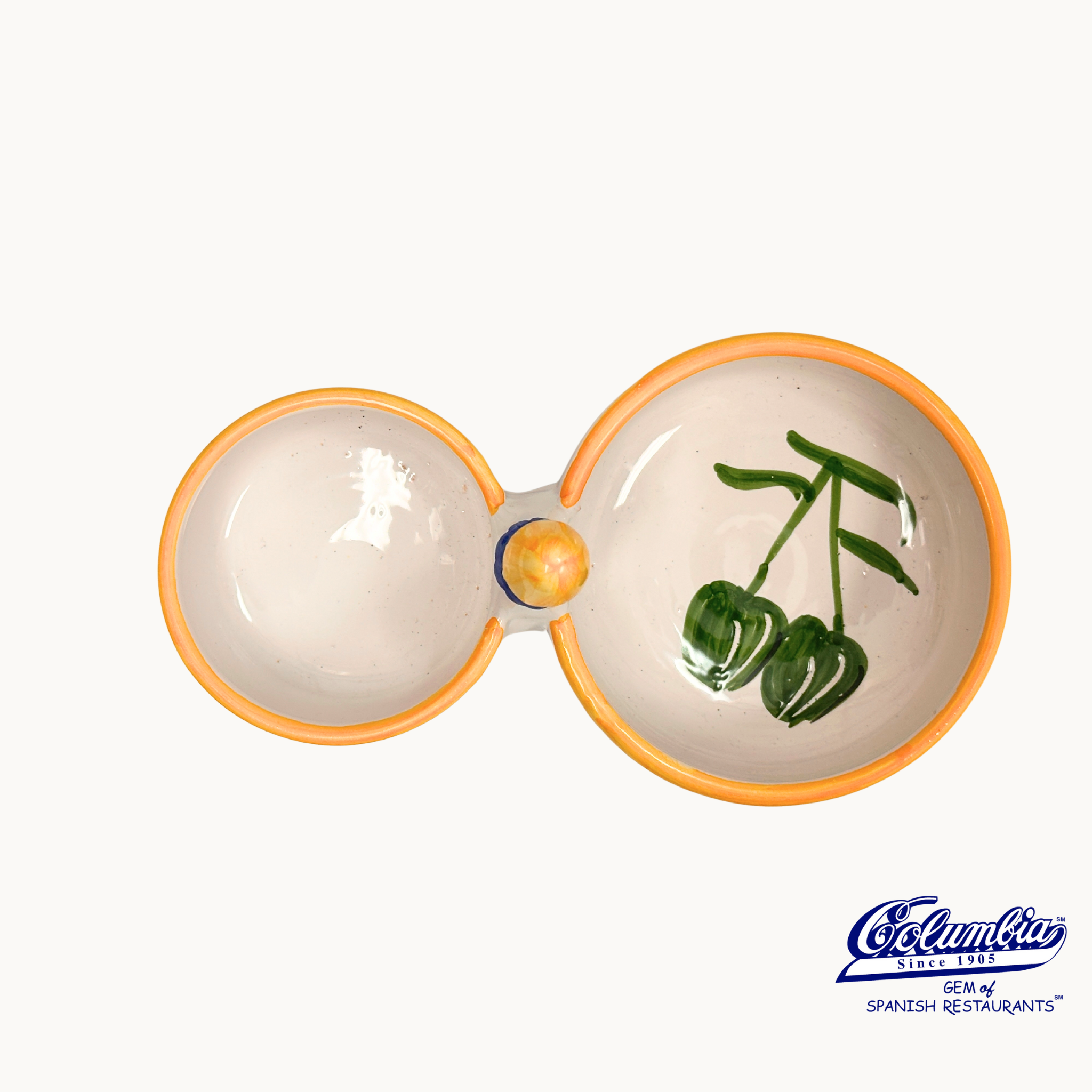 Ceramic salt and pepper shaker with greenery design on a white background, featuring the El Cangrejo logo.