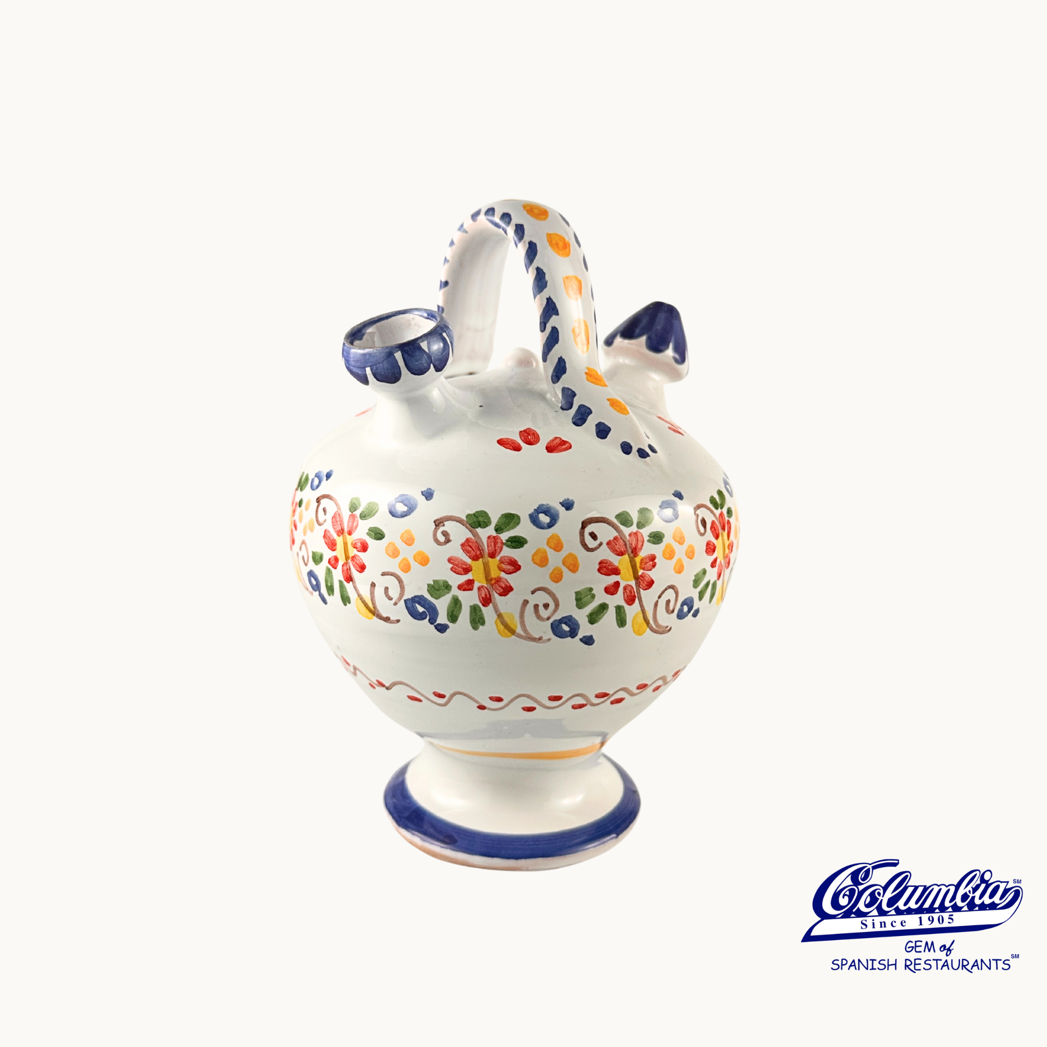 Decorative ceramic jar with colorful patterns on a white background, featuring the Columba brand.