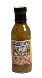 A bottle of Columbia 1905 Dressing, with a label showing the brand name and the product name, placed against a plain background.